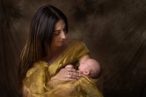 newborn portrait - mother cradling baby