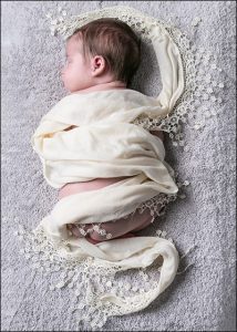 newborn baby wrapped in cloth