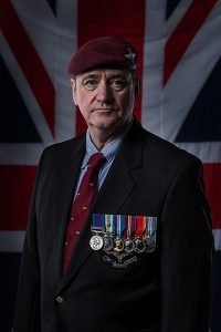 heirloom portrait - ex-serviceman wearing his medals in front of the Union Jack
