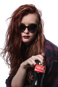 model portfolio shoot - woman holding a soft drink